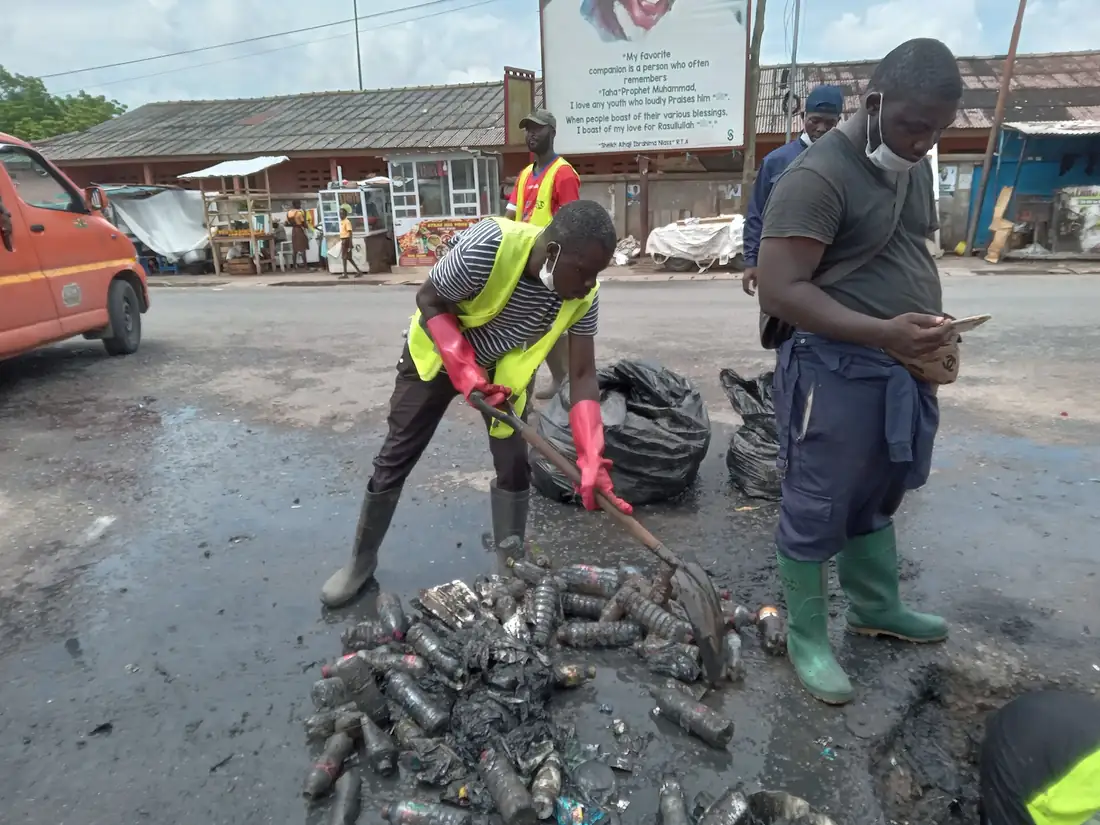 Volunteers cleaning a street in Accra